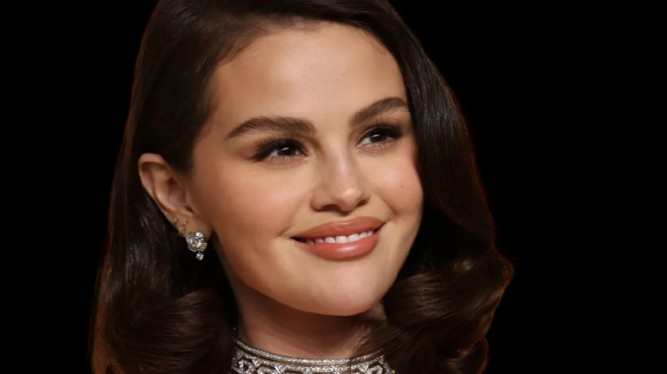 Selena Gomez showing off her red lovergirl nails in a classic almond shape with radiant shine and undeniable romance.