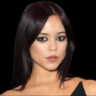 Jenna Ortega debuts bleached brows at CinemaCon 2025, sporting a bold Versace look with lavender tones.