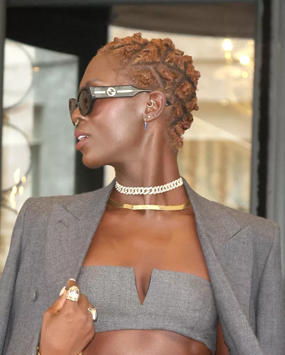 10 Protective Hairstyles for Spring That’ll Have You Serving Looks All Season 5 A woman flaunting a trendy spring protective hairstyle, featuring flawless braids and twists, perfect for spring’s fresh and stylish vibe.