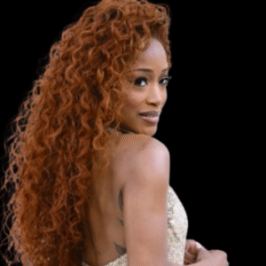 Keke Palmer Just Flipped Her Red Long Mermaid Curls & Dethroned Ariel 4 Keke Palmer in a long red curly hairstyle and sparkling gown, channeling a glamorous modern version of Disney’s Little Mermaid.