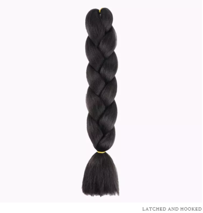 7 Healthier Braiding Hair Brands to Try Before Your Next Protective Style 6 A woman flaunting long, healthy braids made from non-toxic, eco-friendly braiding hair brands, showcasing shine, volume, and scalp comfort.