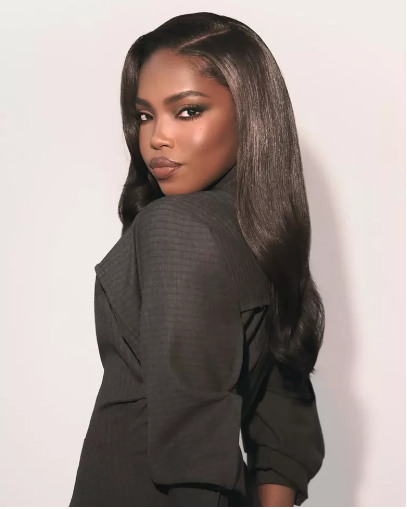 10 Protective Hairstyles for Spring That’ll Have You Serving Looks All Season 4 A woman flaunting a trendy spring protective hairstyle, featuring flawless braids and twists, perfect for spring’s fresh and stylish vibe.