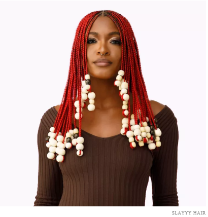 7 Healthier Braiding Hair Brands to Try Before Your Next Protective Style 5 A woman flaunting long, healthy braids made from non-toxic, eco-friendly braiding hair brands, showcasing shine, volume, and scalp comfort.