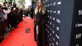Angelina Jolie stuns in chocolate brown trench coat, proving chocolate brown is fall’s must-have hue.