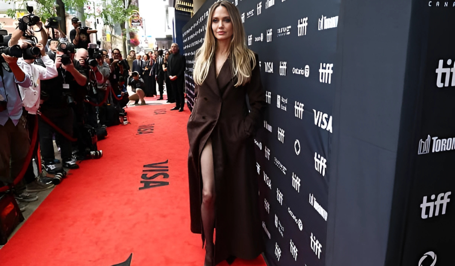 Angelina Jolie stuns in chocolate brown trench coat, proving chocolate brown is fall’s must-have hue.