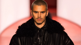 Romeo Beckham walks the runway at London Fashion Week in an all-black leather bomber and cargo trousers for H&M’s A/W25 collection debut.