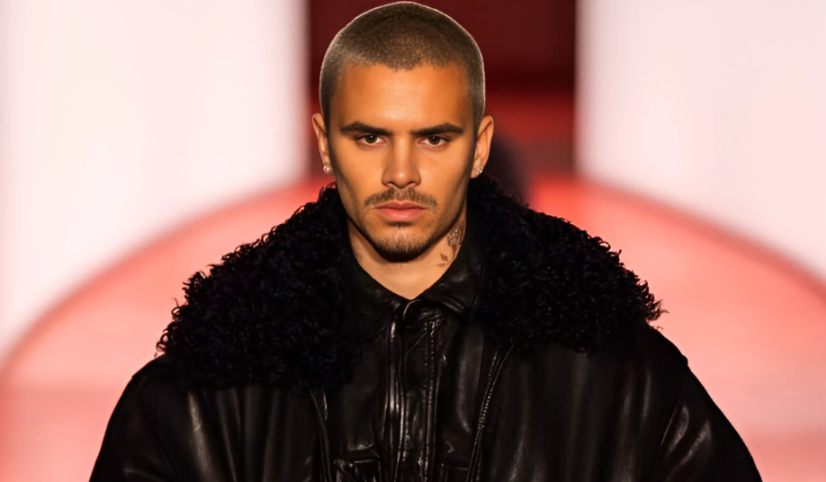 Romeo Beckham walks the runway at London Fashion Week in an all-black leather bomber and cargo trousers for H&M’s A/W25 collection debut.