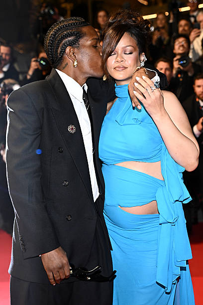 Rihanna & A$AP Rocky Welcome Baby No. 3 — Surprise, It’s a Girl! 2 Rihanna and A$AP Rocky holding newborn daughter Rocki Irish Mayers, with sons RZA and Riot smiling alongside them in a family photo.