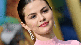 Selena Gomez wedding beauty look with iridescent manicure, sleek lob hairstyle, and soft glam makeup.