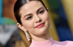 Selena Gomez wedding beauty look with iridescent manicure, sleek lob hairstyle, and soft glam makeup.