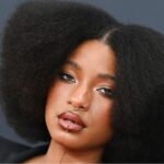 Willow Smith wearing a stacked braided updo and frosty baby-blue eyeshadow at Dior Paris Fashion Week