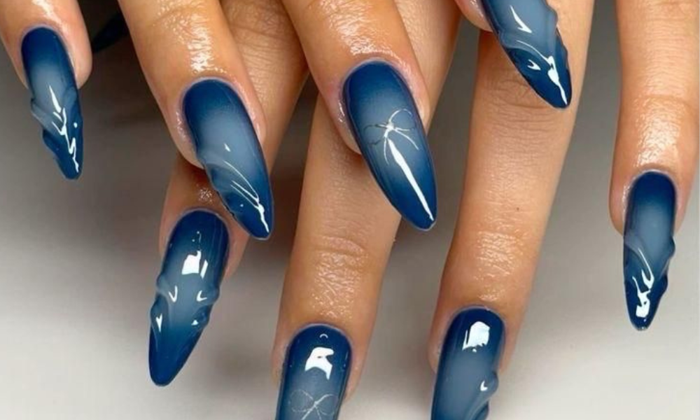 Close-up of navy aura nails inspired by Kate Hudson with soft blended gradient effect