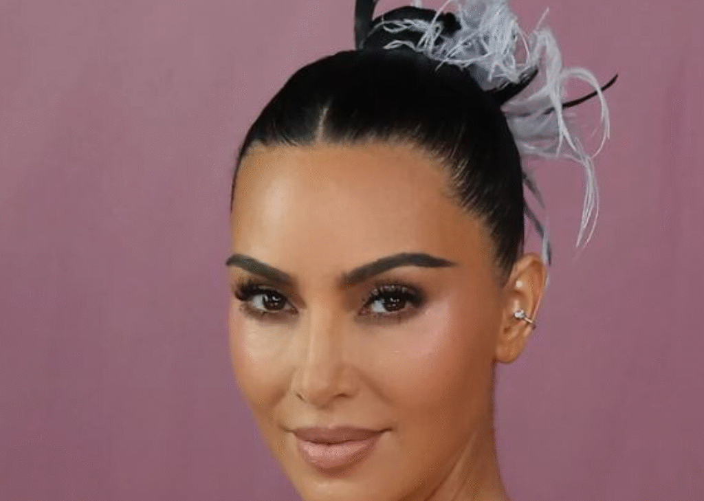 Kim Kardashian Wears a Whimsical Feathered Updo in Rio 1 Kim Kardashian vintage feather updo at All’s Fair Rio premiere