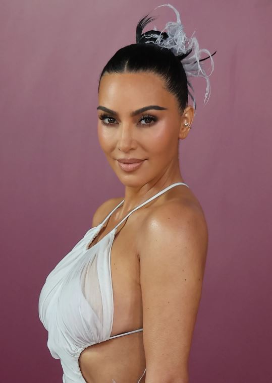 Kim Kardashian Wears a Whimsical Feathered Updo in Rio 9 Kim Kardashian vintage feather updo at All’s Fair Rio premiere