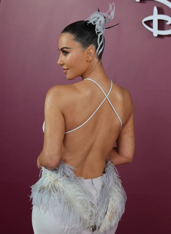 Kim Kardashian Wears a Whimsical Feathered Updo in Rio 8 Kim Kardashian vintage feather updo at All’s Fair Rio premiere