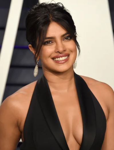 25 Iconic Celebrity Curtain Bangs Styles That Always Look Amazing 14 Priyanka Chopra’s curtain bangs add softness to her strong bone structure