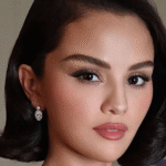 Selena Gomez shows off her ornate jeweled nails with pearls, gems, and gold detailing