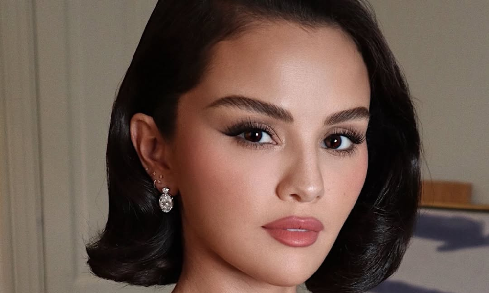 Selena Gomez shows off her ornate jeweled nails with pearls, gems, and gold detailing