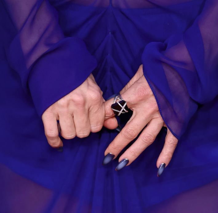 Kate Hudson showing medium-length navy blue aura nails with a soft blue gradient at the Song Sung Blue premiere