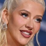 Christina Aguilera showing her retro red-and-white holiday manicure on The Jennifer Hudson Show