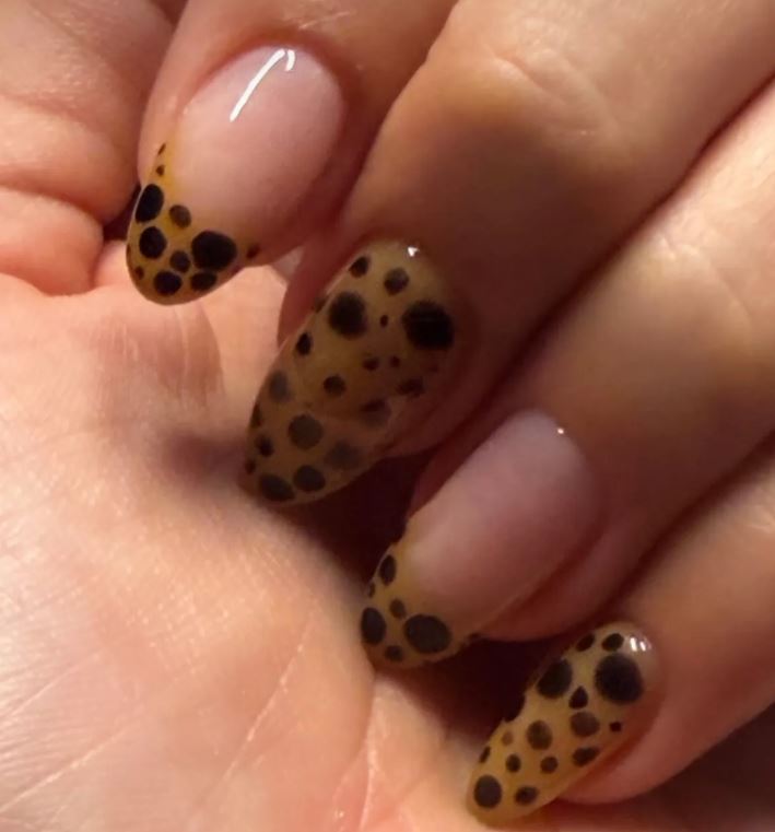 A close up photo of Hailey Bieber’s Cheetah French Nails for holidays
