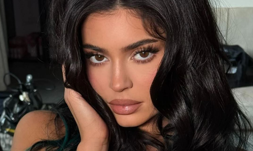 Kylie Jenner’s Santa Red Latex Dress Is Pure Christmas Glam 36 Kylie Jenner wearing a Santa red latex dress at a holiday party with glossy red manicure and sleek hair styling