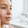 Microbiome & Barrier Repair: The Ingredients to Use (and Avoid) 4 Woman applying microbiome-friendly skincare with barrier repair moisturizer for healthy, glowing skin