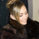 Miley Cyrus Just Made ‘90s Prom Hair Look Like an Everyday Thing 6 Miley Cyrus wearing a 90s prom-inspired spiky bun hairstyle on Jimmy Kimmel Live