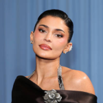 See Kylie Jenner’s Tangerine Manicure That Said “Move, Winter — I’m Talking!” 5 Kylie Jenner wearing long glossy tangerine coffin nails at the Marty Supreme premiere