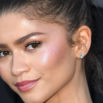 Minimalist skinimalism skincare routine layout with five essential products including cleanser, serum, moisturizer, toner, and sunscreen