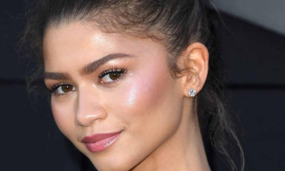 Minimalist skinimalism skincare routine layout with five essential products including cleanser, serum, moisturizer, toner, and sunscreen