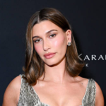 Close-up of Hailey Bieber manicure with deep blue nail polish