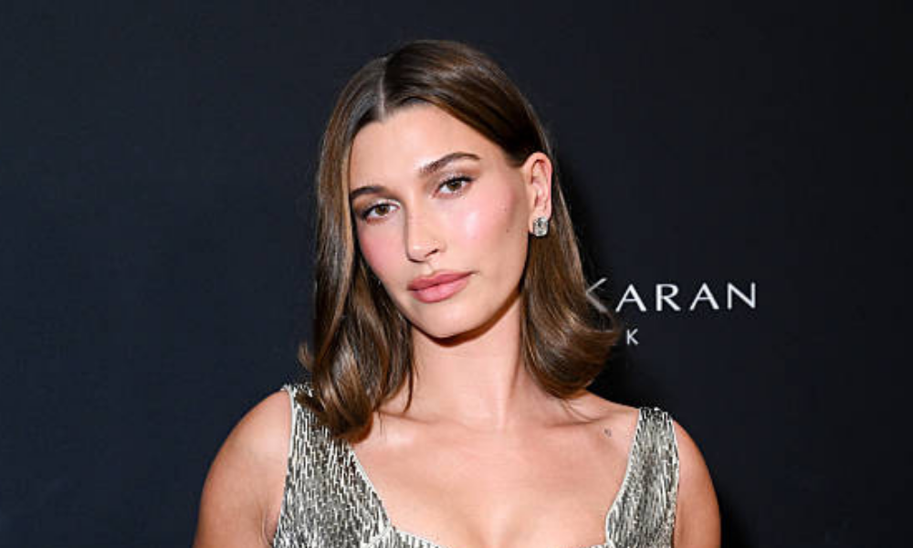 Close-up of Hailey Bieber manicure with deep blue nail polish