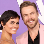 Hayley Erbert and Derek Hough holding their newborn daughter Everley Capri after her birth