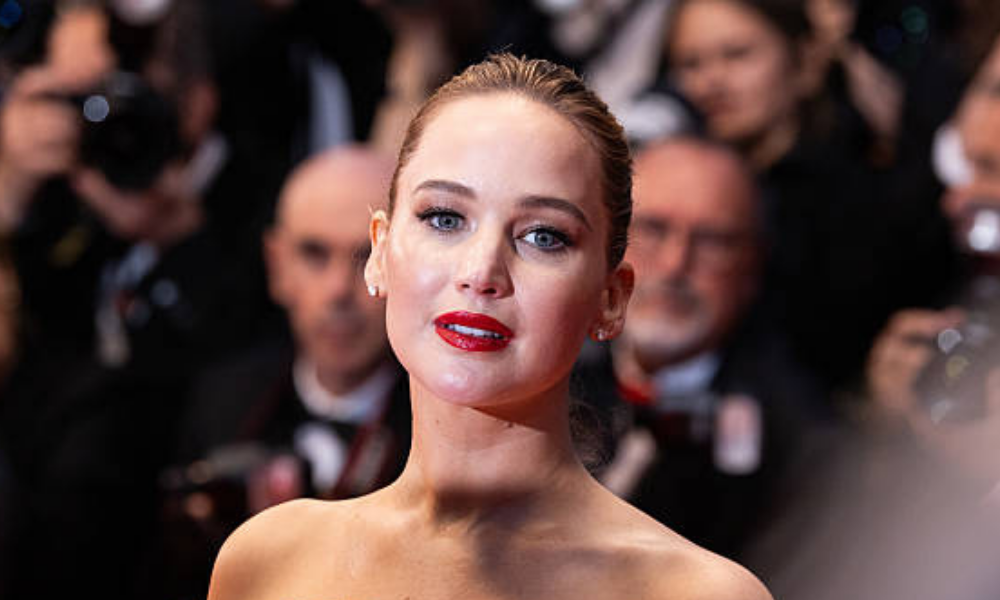 Jennifer Lawrence wearing a sheer see-through dress on the red carpet at the 83rd Golden Globe Awards