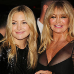 Kate Hudson and Goldie Hawn posing together with matching blonde lobs, glowing skin, and natural glam makeup at a Los Angeles event