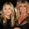 Kate Hudson and Goldie Hawn posing together with matching blonde lobs, glowing skin, and natural glam makeup at a Los Angeles event