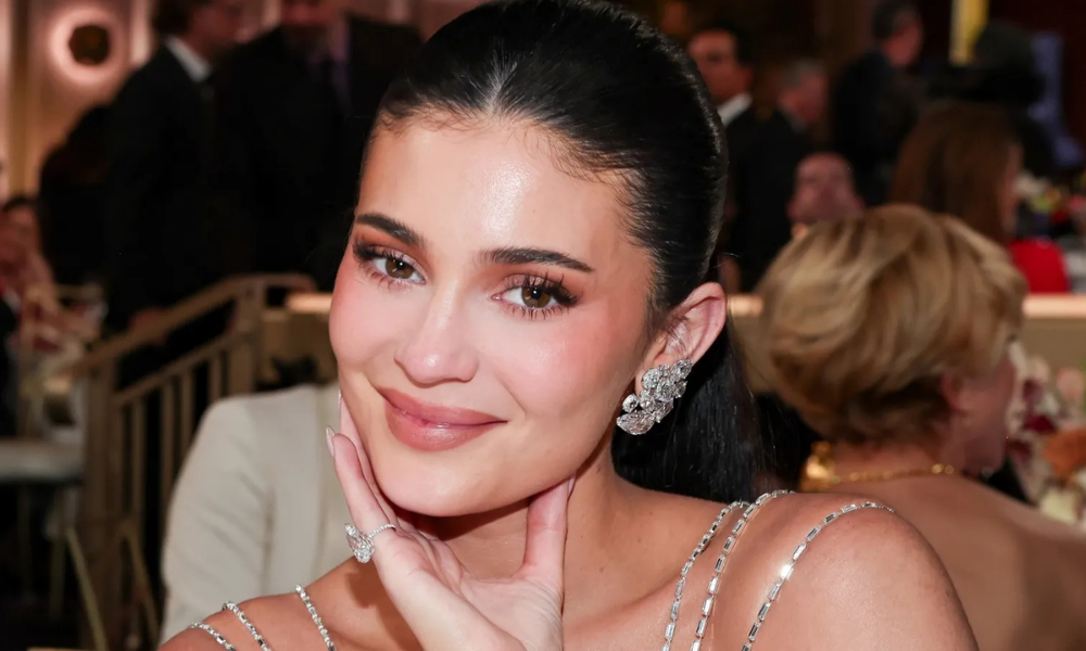 Kylie Jenner dipping her face into an ice water facial bath before makeup preparation