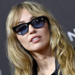 Miley Cyrus debuting a modern Hannah Montana–inspired hairstyle with curtain bangs and soft waves at the Palm Springs International Film Festival